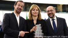 German film director Maren Ade (C) holds her award next to German producer Jonas Dornbach (L) and European Parliament President Martin Schulz (Getty Images/AFP//F. Florin)