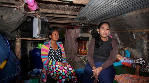 Inside Hour Vanny's cramped shanty home with her sister-in-law Som Tha Satry, 33, who gave birth to twins in October.