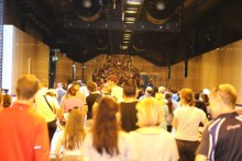 Crowd walking through tunnel (ABC News)