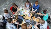 Internet and computer users around a table