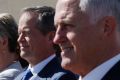 Prime Minister Malcolm Turnbull and Opposition Leader Bill Shorten came together with Tanya Plibersek to link arms at ...