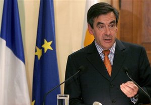 French Prime Minister Francois Fillon speaks to the media after his meeting with Cypriot President Dimitris Christofias , jsa1             