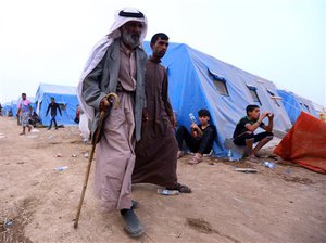 Iraqi refugees from Mosul arrive at Khazir refugee camp outside Irbil, 217 miles (350 kilometers) north of Baghdad, Iraq, Thursday, June 12, 2014.