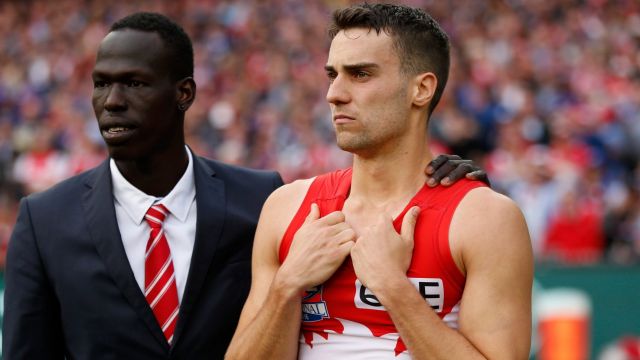 Xavier Richards and Aliir Aliir commiserate after this year's grand final.