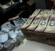 Stacks of banknotes are piled on a desk in a bakery in Caracas. Once one of the world's strongest currencies, the ...