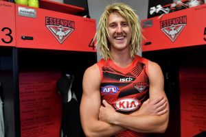 Boots 'n' all: there's no hiding Dyson Heppell's delight at being back in the Bombers locker room.