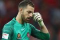 Emotions got the better of him: Jerrad Tyson of the Wanderers looks dejected after conceding the penalty that gave ...