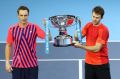 Champions: Henri Kontinen (left) and John Peers lift the trophy.