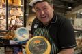 Cheerful Charlie, as he calls himself, is in charge of the gourmet cheese selection in the Dromana store.