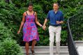 Michelle Obama walks with Barack Obama wearing Sophie Theallet at an Independence Day barbeque on the South Lawn of the ...