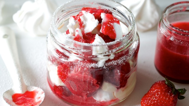 Eton mess with strawberry sauce.