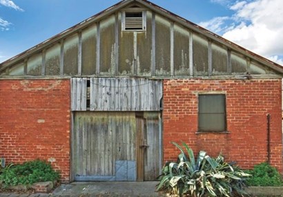 Derelict stable smashes reserve to sell for nearly $3m 