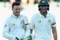 All smiles: Peter Handscomb, left, and Renshaw walk off the Adelaide Oval after claiming victory.