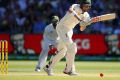 Waiting for a loose delivery: Matthew Renshaw gets the ball away during a very patient innings.