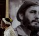 A woman walks past one of hundreds of tribute sites to Fidel Castro set up across Cuba.