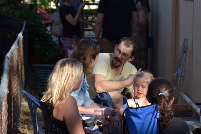 Julian Scharf chats to guests at his party.