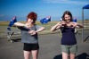 Girls write traditional Kiwi greetings on their hands in New Zealand.