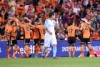 Brisbane Roar players celebrate against City