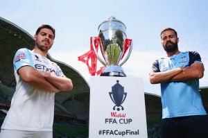 Captains Bruno Fornaroli of the City (L) and Alex Brosque of Sydney FC pose with the FFA Cup on Tuesday.