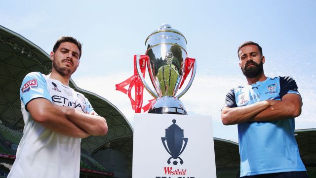 Captains Bruno Fornaroli of the City (L) and Alex Brosque of Sydney FC pose with the FFA Cup on Tuesday.