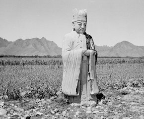 Stone figure of a god, one of many statues of guardian animals and gods lining the approach to the remarkable Ming tombs near Peking, China, is pictured in an undated photo.