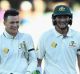 All smiles: Peter Handscomb, left, and Renshaw walk off the Adelaide Oval after claiming victory.