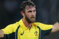 Australia's Glenn Maxwell celebrates scoring a century against Sri Lanka during their first Twenty20 cricket match in ...