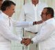 Historic agreement: Colombian President Juan Manuel Santos, front left, and the top FARC commander Rodrigo Londono, ...