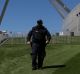 A security guard patrols the lawns at Parliament House.