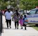 Parents take their children from a school in Craigieburn after a threat was made this week. 