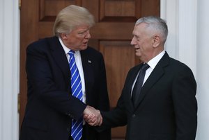 President-elect Donald Trump shakes hands with retired Marine Corps Gen. James Mattis as he leaves Trump National Golf Club Bedminster clubhouse in Bedminster, N.J., Saturday, Nov. 19, 2016. (AP Photo/Carolyn Kaster)