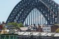 SHD. News. The Sydney Swans flag flies over the Harbour Bridge on the day of the AFL Grand Final, Sydney Swans vs ...