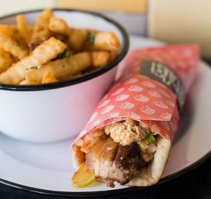 East Coast pork kebab and hot chips with preserved lemon and spiced butter at Biggie Smalls in Collingwood.