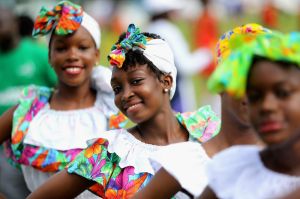 ST GEORGES, GRENADA - NOVEMBER 28: Traditional dancers perform at a community sporting event at Queen Park Ground on the ...