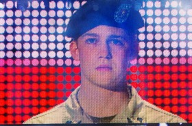 Billy Lynn (Joe Alwyn) fronts up for a fully orchestrated media event in <i>Billy Lynn's Long Halftime Walk</i>.