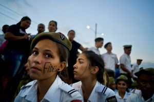 A cadet from the Interior Ministry with the word Fidel painted on her face attends a rally honoring the late Cuban ...