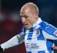 On loan: Manchester City's Aaron Mooy, left, playing for Huddersfield Town against Wigan Athletic in England's second tier.