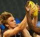 Harry Morrison marks during the 2016 TAC Cup grand final.