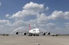 A Qantas A380 taxis to its gate during its inaugural landing at Dallas-Fort Worth International Airport in Texas after ...