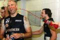 Former AFL star Chris Judd is showered in Powerade.