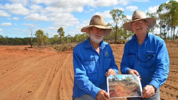 Beef producer David Nicholas (left), pictured with Queensland Agriculture Department officer Bob Shepherd at a gully ...