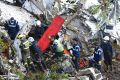 Rescue workers at the crash site south of Medellin in Colombia.