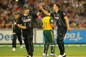 Patrick Cummins (right) in a rare moment of celebration on the field, alongside Shane Watson playing against South ...
