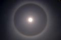 A halo around the sun appears just before midday. The red line on its inside is because red light bends slightly less ...
