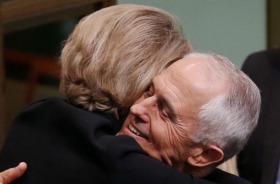 Malcolm Turnbull and Michaelia Cash hug after the ABCC victory.