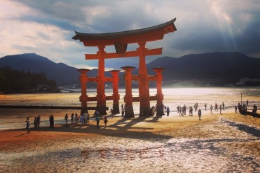 This photo was taken at Miyajima Island in the afternoon on a humid day. The light through the clouds and the shadows of ...