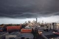 Heavy storm clouds move over Brisbane on Saturday. 