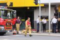 Emergency services outside the Springvale bank after the attack.