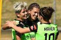 Michelle Heyman celebrates with teammates after scoring a goal during the round four W-League match between Canberra ...