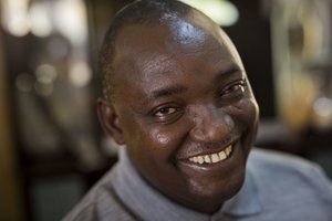 Gambian President elect Adama Barrow sits for an interview with the Associated Press at his residence in Yundum, Gambia, Saturday Dec. 3, 2016. Gambia’s newly elected president Barrow says he will free the country’s political prisoners, reverse the former administration’s decision to leave the International Criminal court and lead a transition government for only three years.